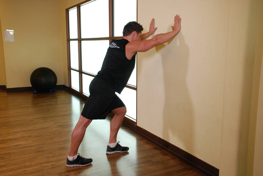Calf Stretch Hands Against Wall demonstration