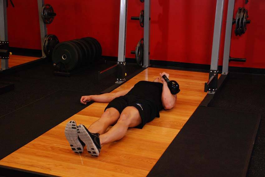 One-Arm Kettlebell Floor Press demonstration