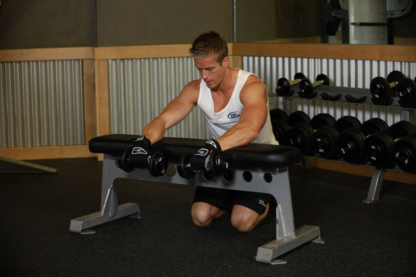 Palms-Down Dumbbell Wrist Curl Over A Bench demonstration