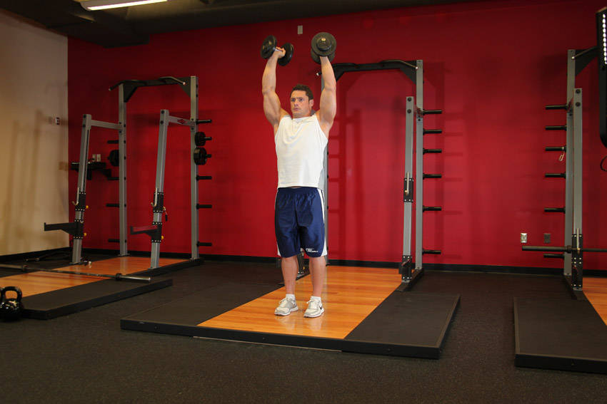Standing Palms-In Dumbbell Press demonstration